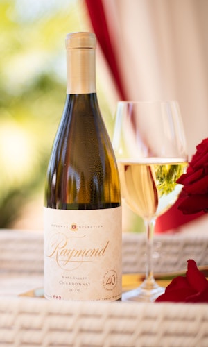 Raymond Vineyards Napa Valley Chardonnay being served outdoors with roses